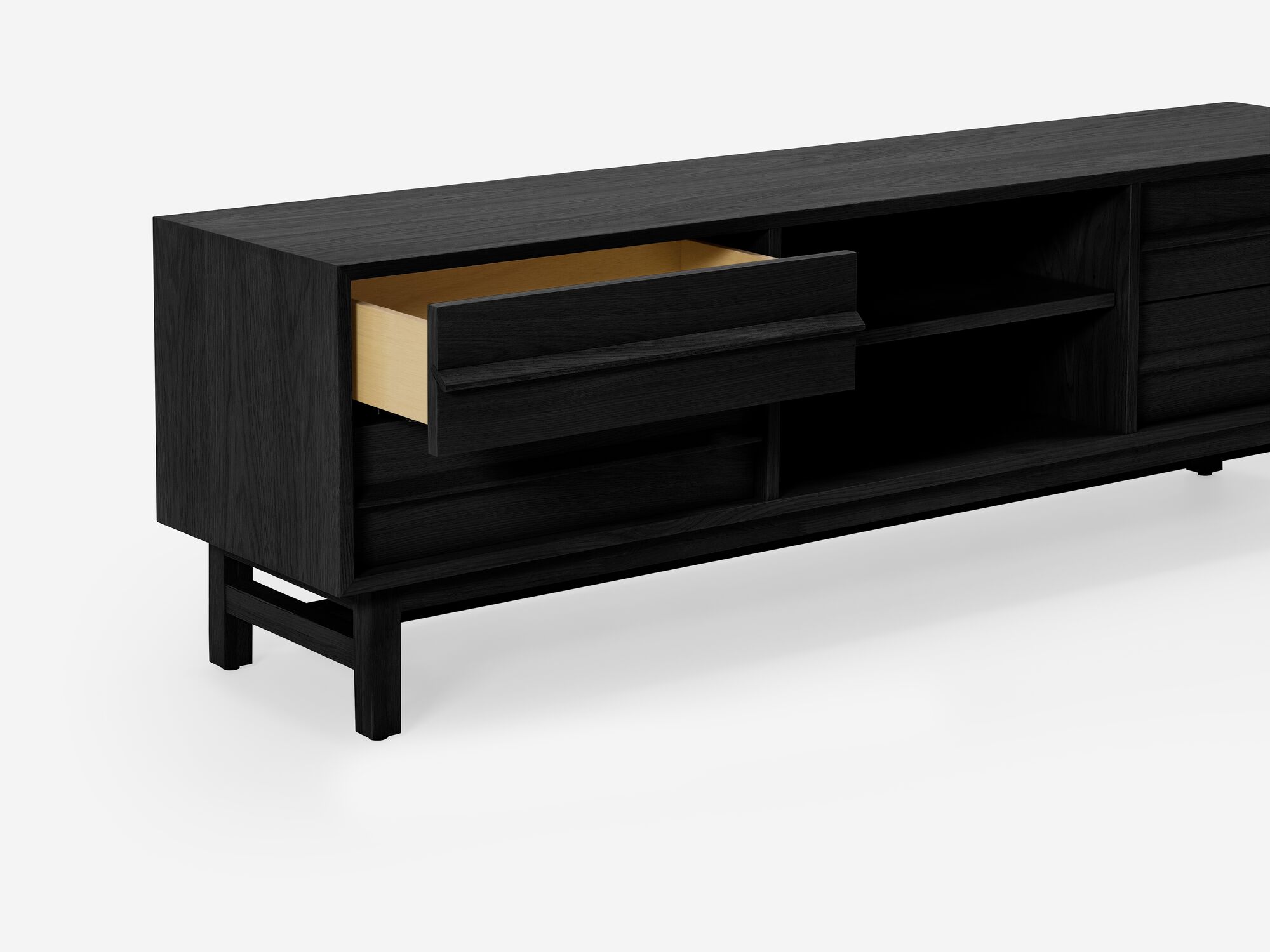 Detail view of small black oak media unit top drawer